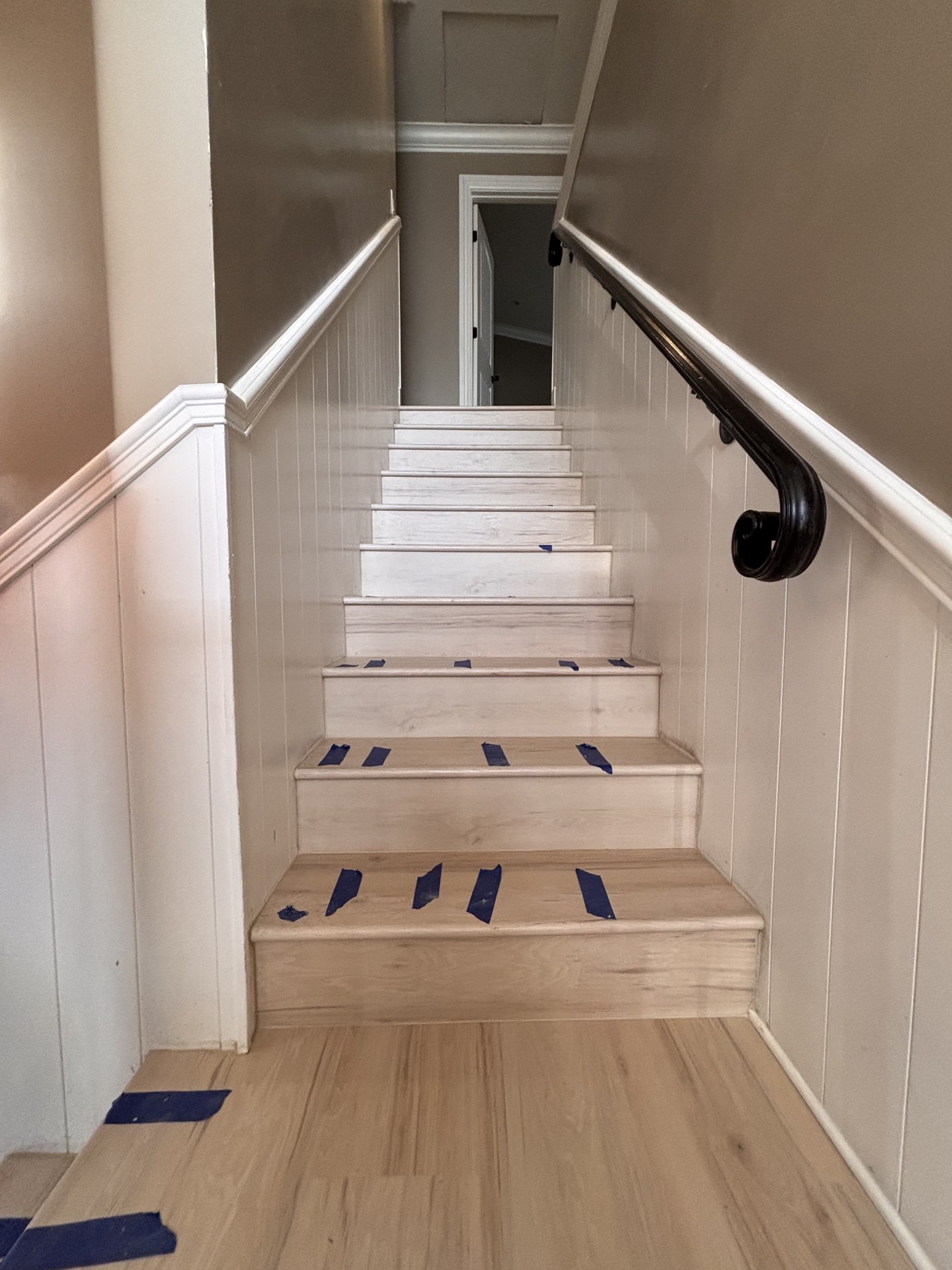 Staircase and plank flooring by One Way Flooring