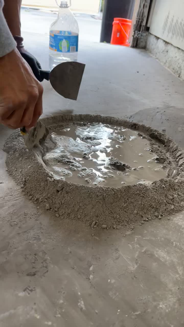Video showing material being mixed by hand during floor preparation