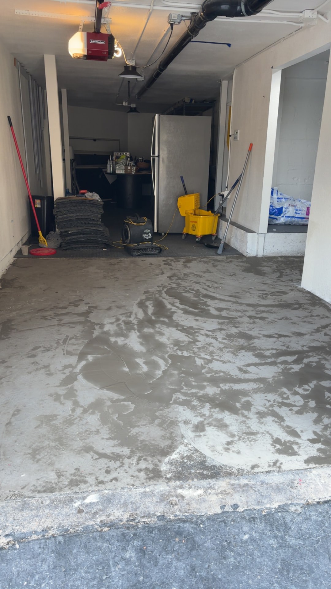 Bare concrete garage floor before the floor tile installation