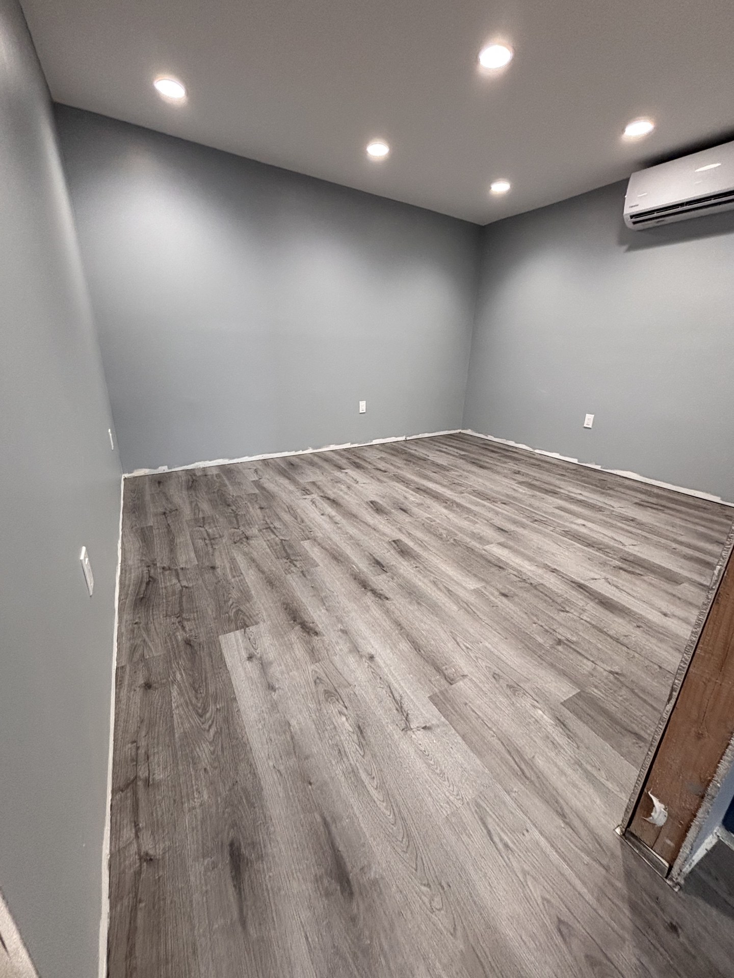 Close-up of newly installed wood-look plank flooring