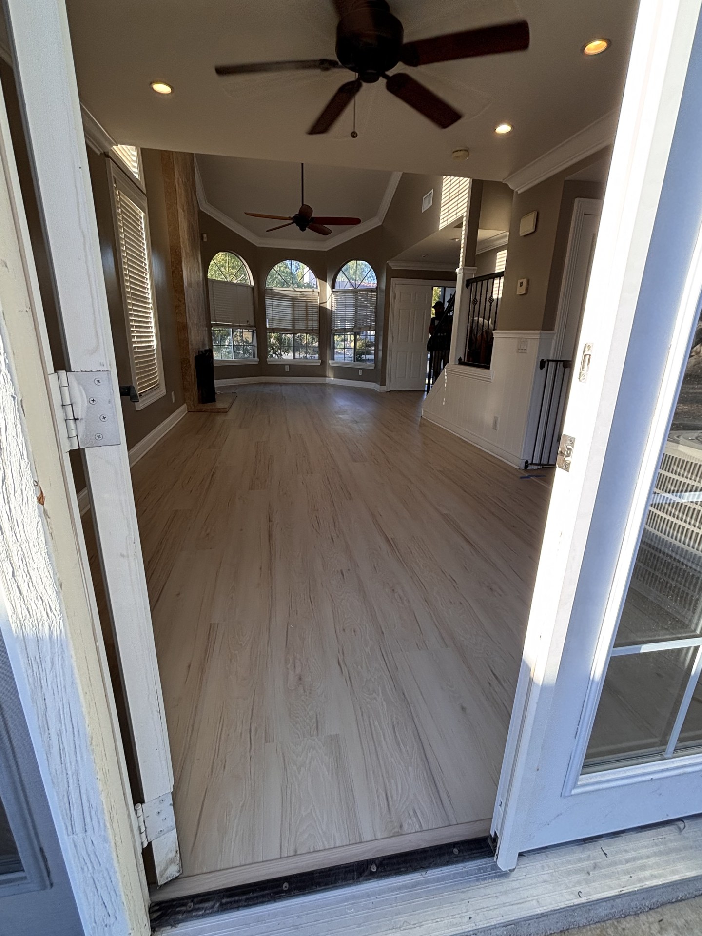Light wood-look floor installed by One Way Flooring